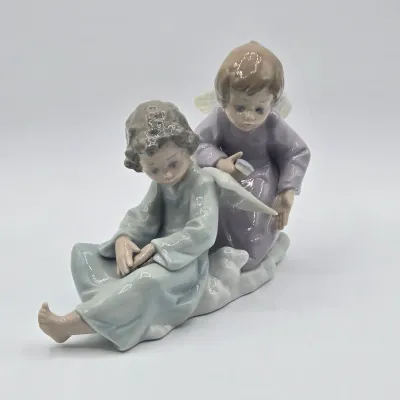 LOT 22L: Retired Lladró "Angel Care" Porcelain Figurine