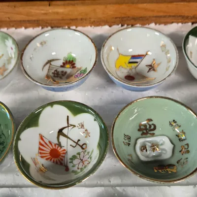 LOT 132F: Large Collection of Antique Japanese Military Sake Cups, Four Sake Bottles, and Beautiful Wood Chest for Storage