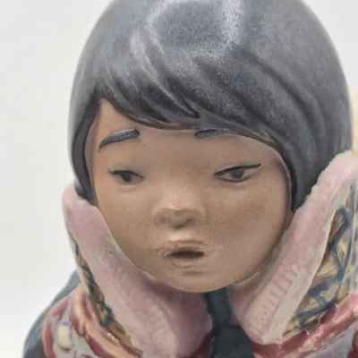 LOT 47L: Lladró "Pensive Eskimo Boy", "Pensive Eskimo Girl" Figurines, and "Attentive Polar Bear" Figurine