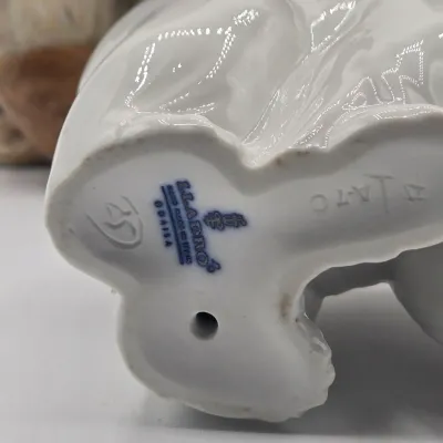 LOT 47L: Lladró "Pensive Eskimo Boy", "Pensive Eskimo Girl" Figurines, and "Attentive Polar Bear" Figurine