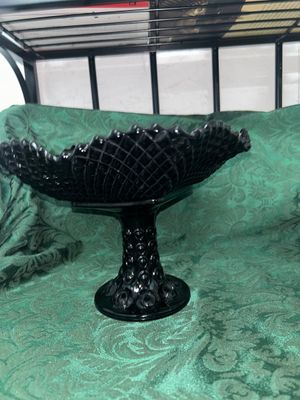 Sale Photo Thumbnail #631: VINTAGE BLACK AMETHYST GLASS COMPOTE PEDESTAL BOWL WITH FOUR MATCHING HOBNAIL/DIAMOND POINT TUMBLERS. FEATURES A TEXTURED GEOMETRIC PATTERN AND STARBURST BASE DETAILS. LIGHT WEAR FROM USE, NO VISIBLE CHIPS OR CRACKS.