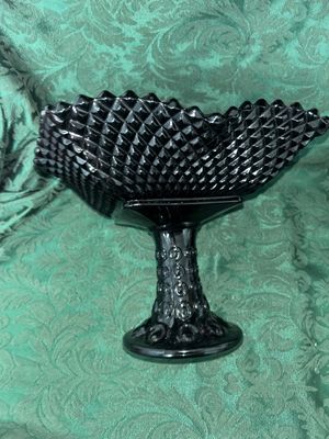 Sale Photo Thumbnail #633: VINTAGE BLACK AMETHYST GLASS COMPOTE PEDESTAL BOWL WITH FOUR MATCHING HOBNAIL/DIAMOND POINT TUMBLERS. FEATURES A TEXTURED GEOMETRIC PATTERN AND STARBURST BASE DETAILS. LIGHT WEAR FROM USE, NO VISIBLE CHIPS OR CRACKS.