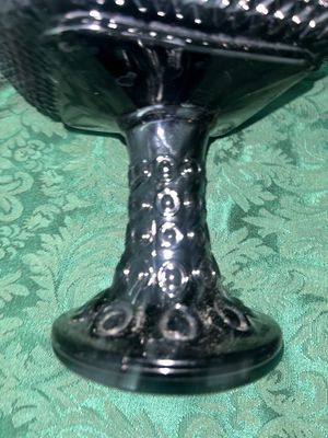 Sale Photo Thumbnail #634: VINTAGE BLACK AMETHYST GLASS COMPOTE PEDESTAL BOWL WITH FOUR MATCHING HOBNAIL/DIAMOND POINT TUMBLERS. FEATURES A TEXTURED GEOMETRIC PATTERN AND STARBURST BASE DETAILS. LIGHT WEAR FROM USE, NO VISIBLE CHIPS OR CRACKS.