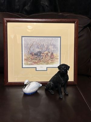 Sale Photo Thumbnail #354: DM SPENCER SIGNED AND NUMBERED (182/604) FRAMED ART PRINT TITLED "NOVICES" FEATURING HUNTING DOG PUPPIES AND DUCKS. INCLUDES BLACK LABRADOR FIGURINE AND SWAN/DUCK FIGURINE. FRAME HAS LIGHT CORNER WEAR. SEE PHOTOS FOR DETAILS AND MORE. DUCK IS A LINT ROLLE