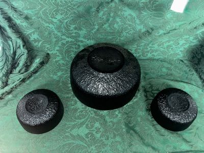 Sale Photo Thumbnail #641: VINTAGE INDIANA GLASS BLACK textured nesting bowl set. Features 1 large serving bowl and 2 matching smaller bowls. Textured bark-like exterior with smooth interior. Good condition with no visible chips or cracks.