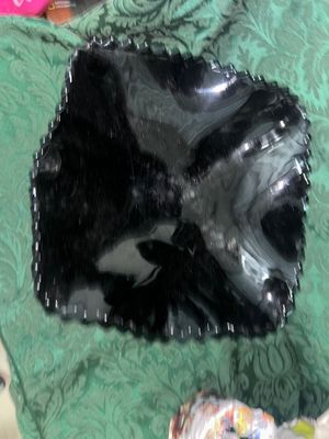 Sale Photo Thumbnail #632: VINTAGE BLACK AMETHYST GLASS COMPOTE PEDESTAL BOWL WITH FOUR MATCHING HOBNAIL/DIAMOND POINT TUMBLERS. FEATURES A TEXTURED GEOMETRIC PATTERN AND STARBURST BASE DETAILS. LIGHT WEAR FROM USE, NO VISIBLE CHIPS OR CRACKS.