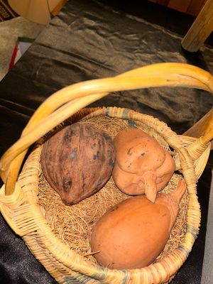 BLANKET LADDER, WICKER BASKET AND CLAY VEGETABLES