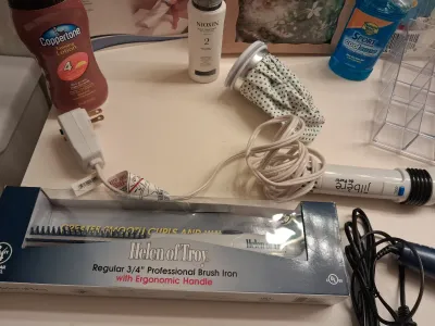 NEW HELEN OF TROY BRUSH IRON, NEW HOT/COLD TUMMY PILLOW, TOILETRIES, SEAL TIGHT CAST/BANDAGE PROTECTOR