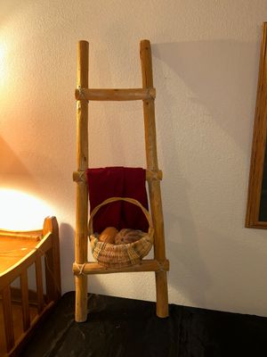 BLANKET LADDER, WICKER BASKET AND CLAY VEGETABLES