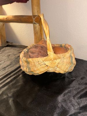 BLANKET LADDER, WICKER BASKET AND CLAY VEGETABLES