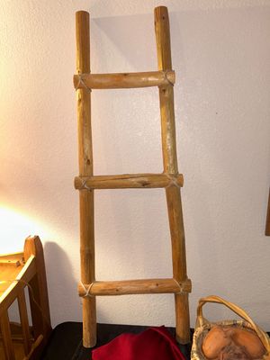 BLANKET LADDER, WICKER BASKET AND CLAY VEGETABLES