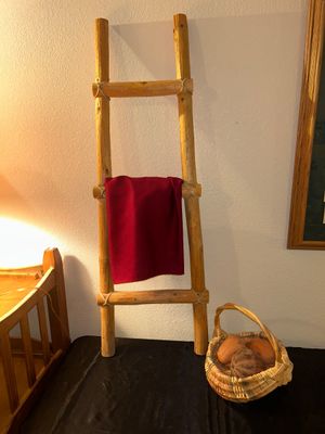 BLANKET LADDER, WICKER BASKET AND CLAY VEGETABLES
