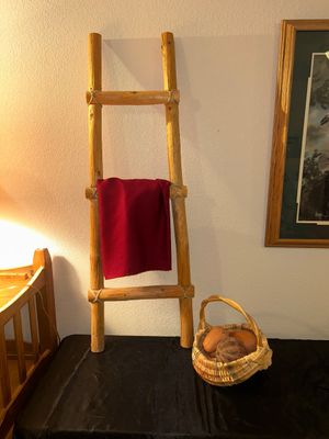 BLANKET LADDER, WICKER BASKET AND CLAY VEGETABLES