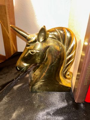 BRASS UNICORN BOOK ENDS AND HARDBACK BOOKS
