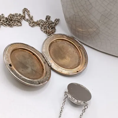 LOT 111: Faux Amber-Incased Scorpion Pendant on a Sarah Coventry Chain, Sarah Coventry Hematite Necklace & More