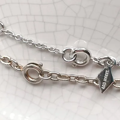 LOT 111: Faux Amber-Incased Scorpion Pendant on a Sarah Coventry Chain, Sarah Coventry Hematite Necklace & More