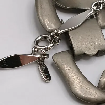 LOT 111: Faux Amber-Incased Scorpion Pendant on a Sarah Coventry Chain, Sarah Coventry Hematite Necklace & More