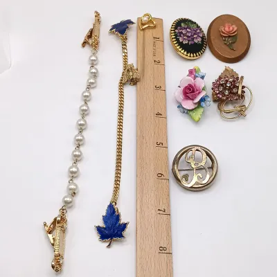 LOT 114: Pearl 1/20 12K GF and Pink Rhinestone Flower Brooch, Vintage Sweater Clips & More
