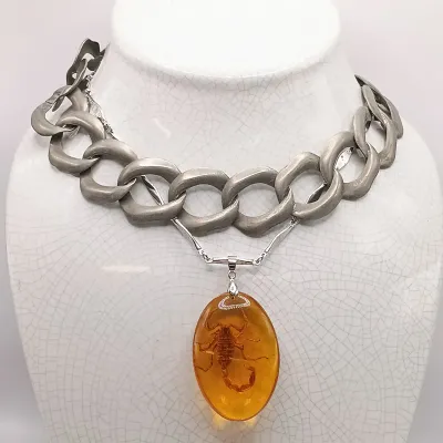 LOT 111: Faux Amber-Incased Scorpion Pendant on a Sarah Coventry Chain, Sarah Coventry Hematite Necklace & More