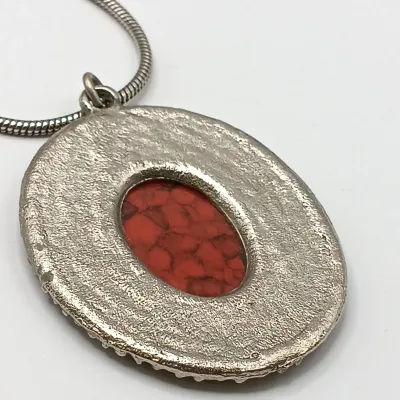 LOT 111: Faux Amber-Incased Scorpion Pendant on a Sarah Coventry Chain, Sarah Coventry Hematite Necklace & More