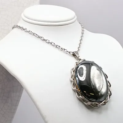 LOT 111: Faux Amber-Incased Scorpion Pendant on a Sarah Coventry Chain, Sarah Coventry Hematite Necklace & More