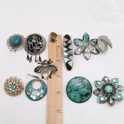 LOT 110: Lucite Jelly Belly Bee Pin, Alpaca Silver Pins and Earrings & More