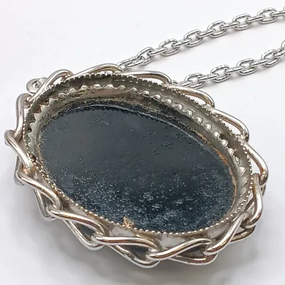 LOT 111: Faux Amber-Incased Scorpion Pendant on a Sarah Coventry Chain, Sarah Coventry Hematite Necklace & More