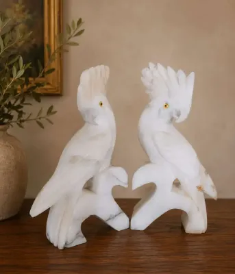 MID-CENTURY SCULPTURED COCKATOO BOOKENDS