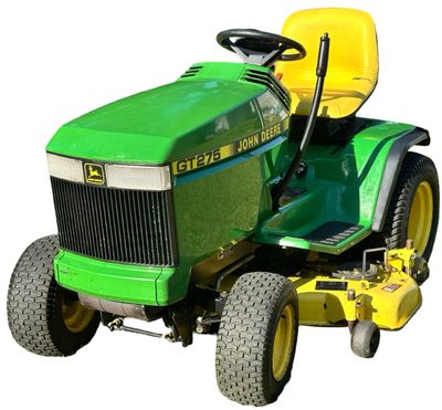 Sale Photo Thumbnail #147: John Deere GT275 Garden Tractor with a Yellow seat, a Mower deck, and Extra Wheel