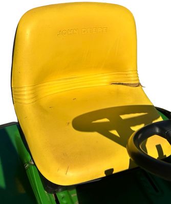 Sale Photo Thumbnail #157: John Deere GT275 Garden Tractor with a Yellow seat, a Mower deck, and Extra Wheel