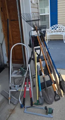 LOT 57: Garage Finds/ Step Ladders, Rakes, Shovels, Sprinklers, and More