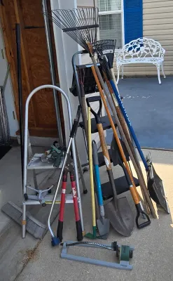 LOT 57: Garage Finds/ Step Ladders, Rakes, Shovels, Sprinklers, and More