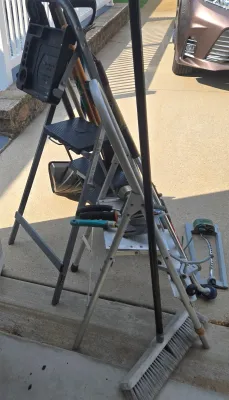 LOT 57: Garage Finds/ Step Ladders, Rakes, Shovels, Sprinklers, and More