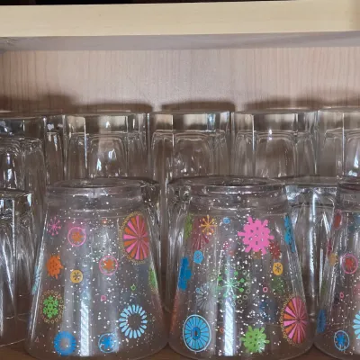 LOT 102: Kitchen Cabinet Lot Including Drinking Glasses. Philadelphia Eagles Mug, Miller Lite Mug, and More