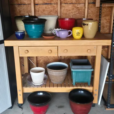 LOT 125: Solid Wooden Potting Table with Drawers and Wheels/48×24×37"/ and Multiple Pots