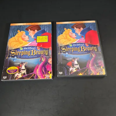 LOT 97: Sorcerer Mickey Mouse "Where Magic Lives" Snow Globe Figurine, Cinderella Wallet, Teapot for One Set, Picture Frame,...