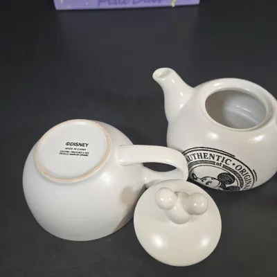 LOT 97: Sorcerer Mickey Mouse "Where Magic Lives" Snow Globe Figurine, Cinderella Wallet, Teapot for One Set, Picture Frame,...