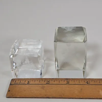 LOT 100: Porcelain Trinket Boxes, Two Clear, Geometric Cut Glass Paperweights, and More