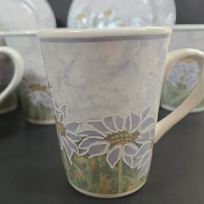 LOT 89: Sango Daisy Hill Coffee Mugs and Dessert Plates/ 8 Each