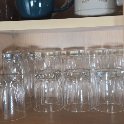 LOT 102: Kitchen Cabinet Lot Including Drinking Glasses. Philadelphia Eagles Mug, Miller Lite Mug, and More