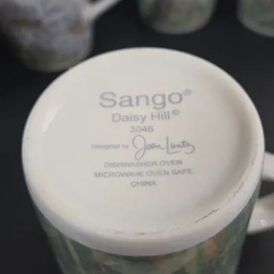 LOT 89: Sango Daisy Hill Coffee Mugs and Dessert Plates/ 8 Each