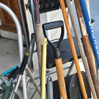 LOT 57: Garage Finds/ Step Ladders, Rakes, Shovels, Sprinklers, and More
