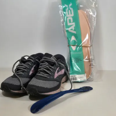 LOT 108: Brooks Women's Revel 'Grey Rose Gold' Running Shoes, Multiple Packs of Apex Shoe Inserts. and Shoe Horn