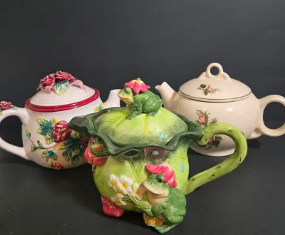LOT 47: Whimsical Frog Teapot, Harry and David Limited Edition White W/ Raised Red Roses Floral Ceramic Teapot, and Ceramic Teapot from...