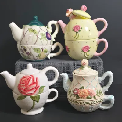 LOT 36: Collection of Four Ceramic Stackable "Tea for One" Teapots and Cups Sets