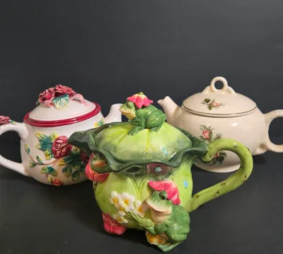 LOT 47: Whimsical Frog Teapot, Harry and David Limited Edition White W/ Raised Red Roses Floral Ceramic Teapot, and Ceramic Teapot from...