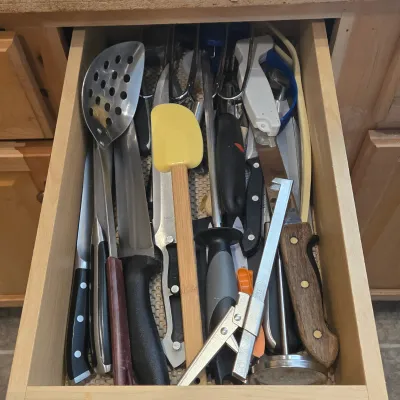 LOT 86: Multiple Kitchen Drawers Lot Including Flatware, Utensils, and More