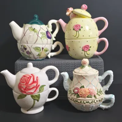 LOT 36: Collection of Four Ceramic Stackable "Tea for One" Teapots and Cups Sets