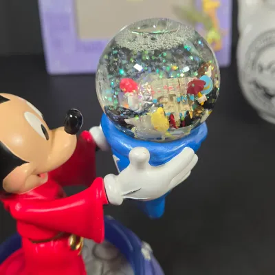 LOT 97: Sorcerer Mickey Mouse "Where Magic Lives" Snow Globe Figurine, Cinderella Wallet, Teapot for One Set, Picture Frame,...