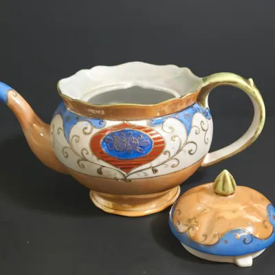 LOT 45: Porcelain Teapot with Basketweave Design and Japanese Lustreware Teapot and Creamer